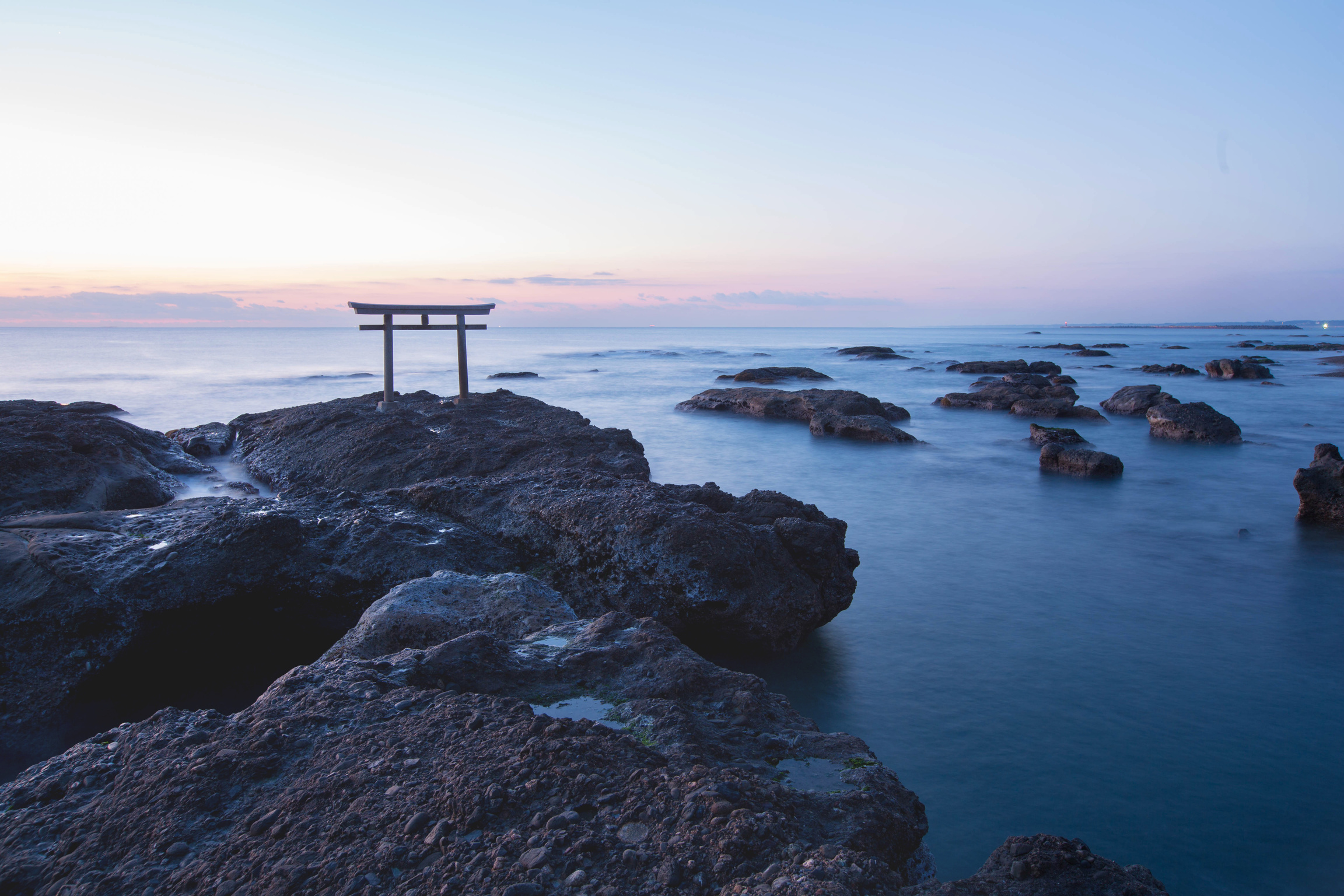 Shrine gate sunrise at sea Oarai city, Ibaraki, Japan.